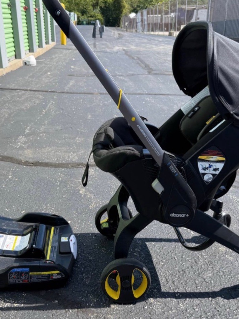 Doona+ Infant Car Seat & Stroller Capsule - Black with Yellow Accents